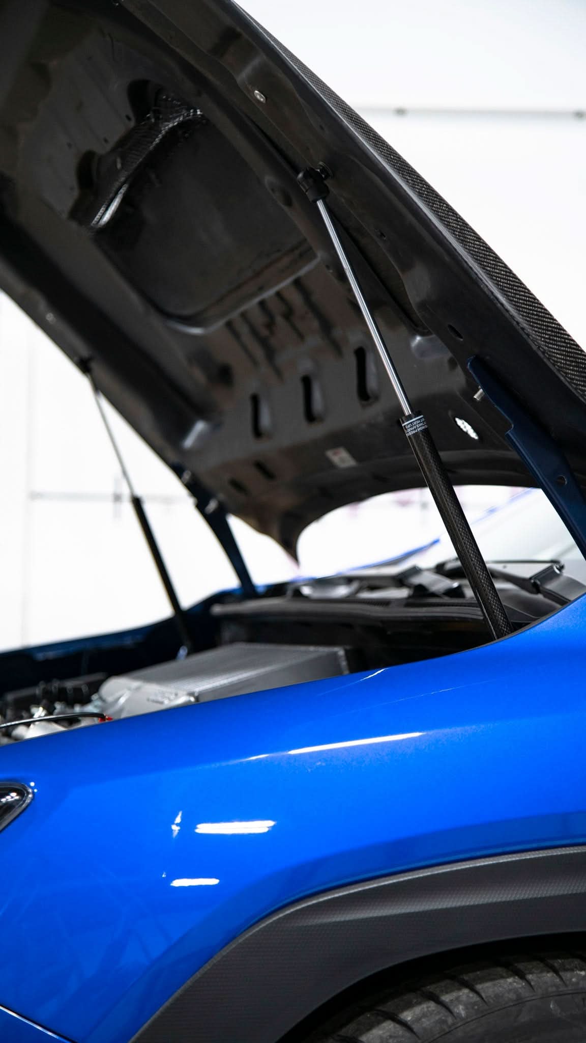 OLM Carbon Fiber Wrapped Hood Struts - 2022+ WRX