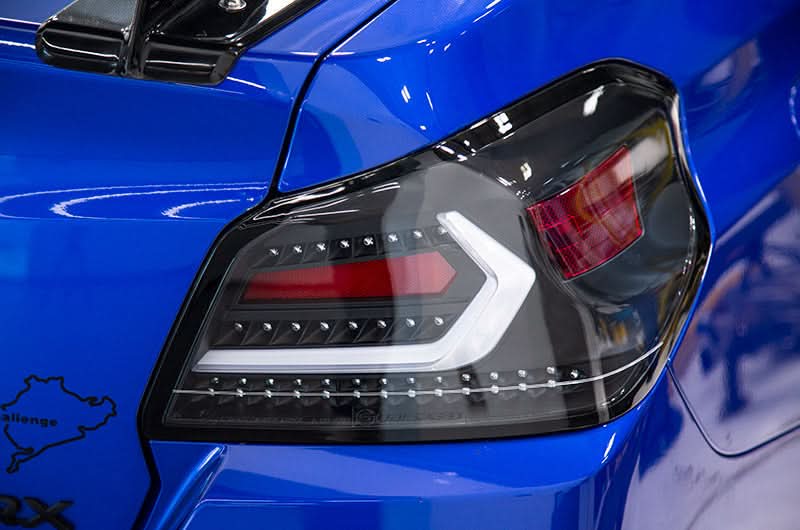 OLM Evolution Tail Lights Clear Lens Black Base White Bar 15+ WRX STI