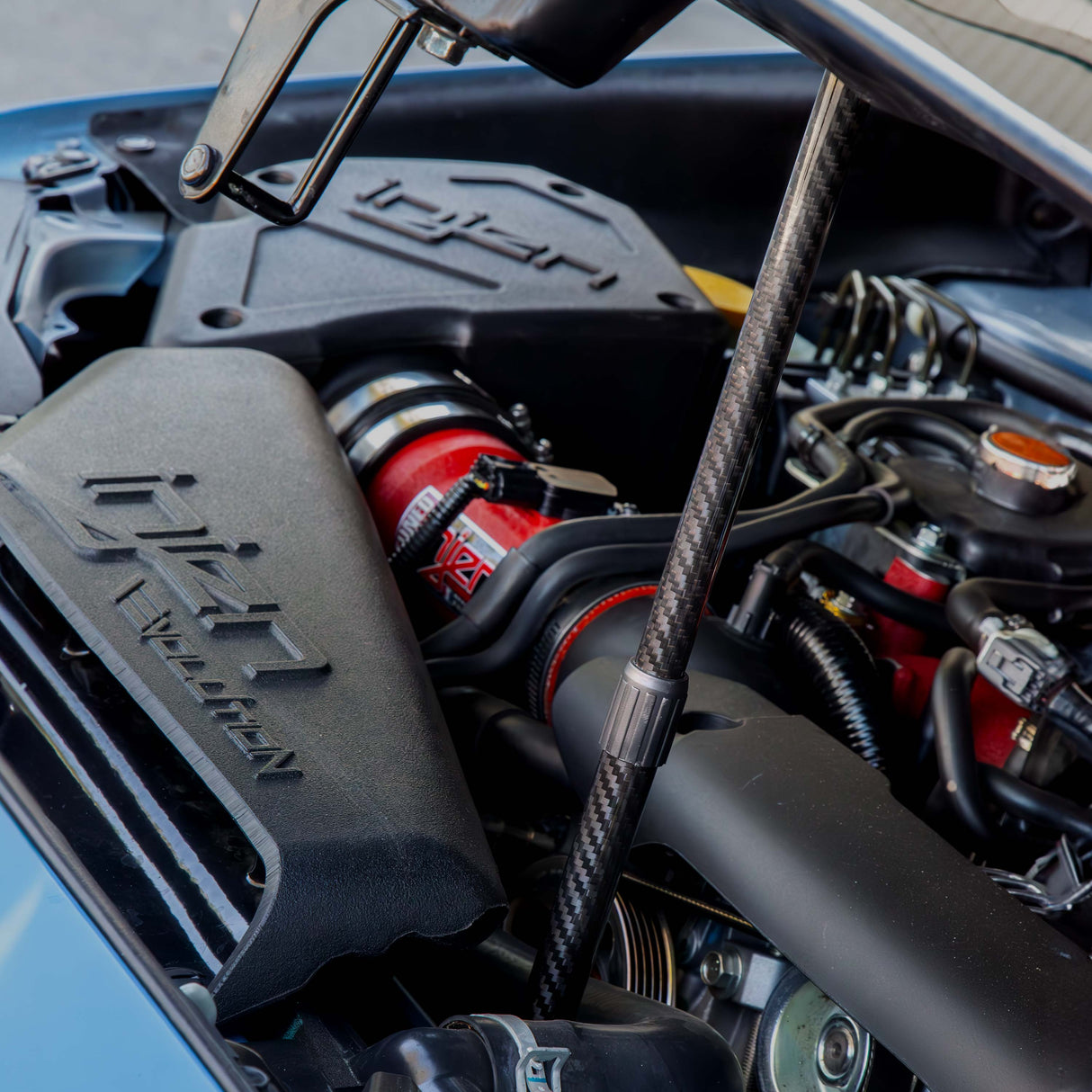 Carbon fiber hood prop