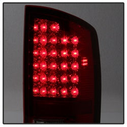 xTune Dodge Ram 1500/Ram 2500/Ram 3500 02-06 Red Clear Lens XTune LED Tail Lights Black Housing