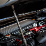 Carbon fiber hood prop with Seibon logo