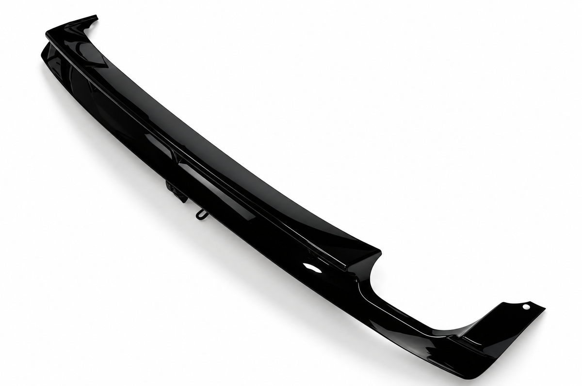 E36 gloss black rear diffuser without LED, original diagonal view showing molded contours, mounting end and single exhaust clearance on white