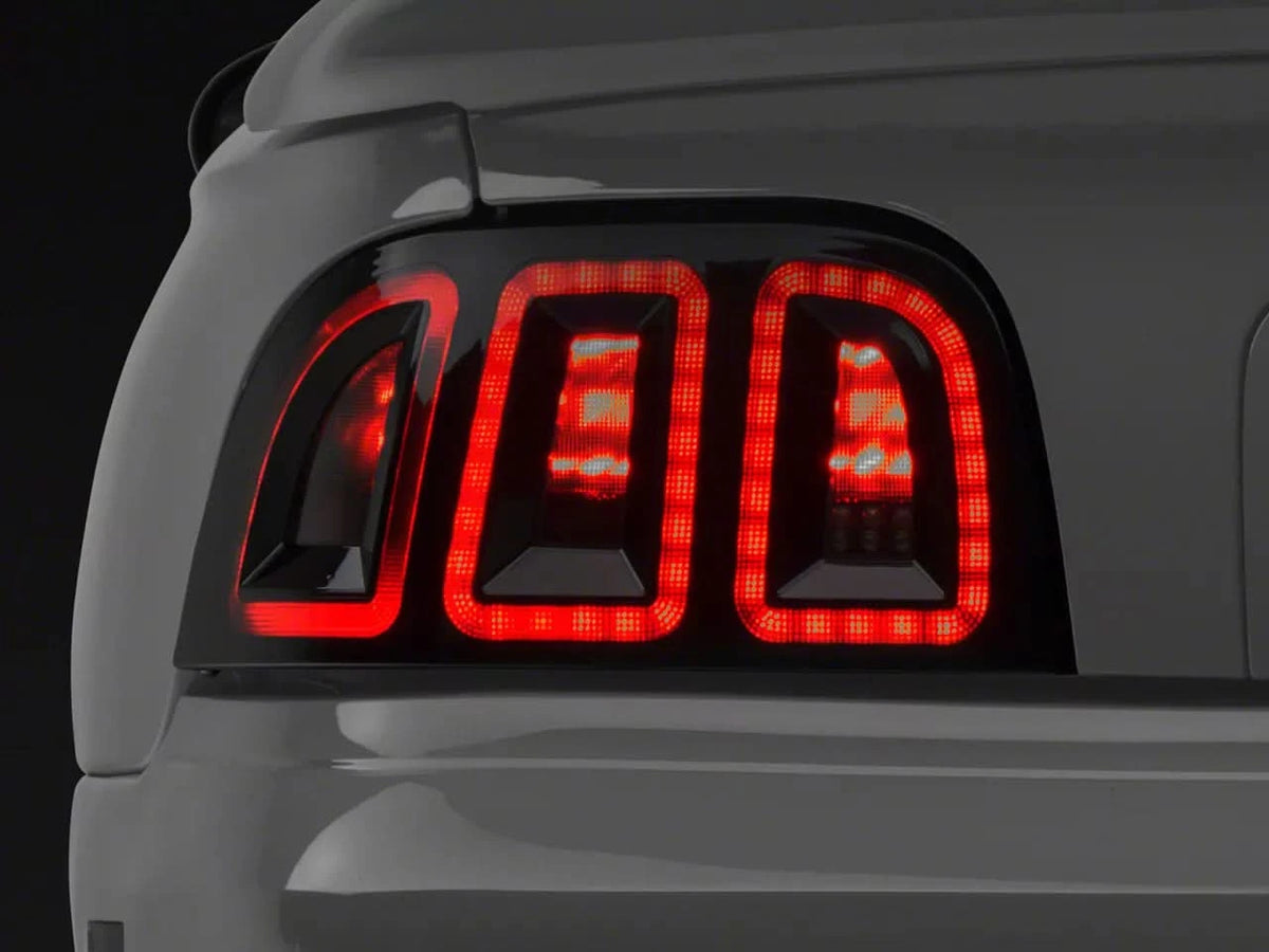 Raxiom Icon Led Tail Lights; Black Housing; Smoked Lens (96-98 Mustang)