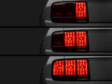 Raxiom Tail Lights And Sequential Tail Light Kit; Black Housing; Smoked Lens (05-09 Mustang)