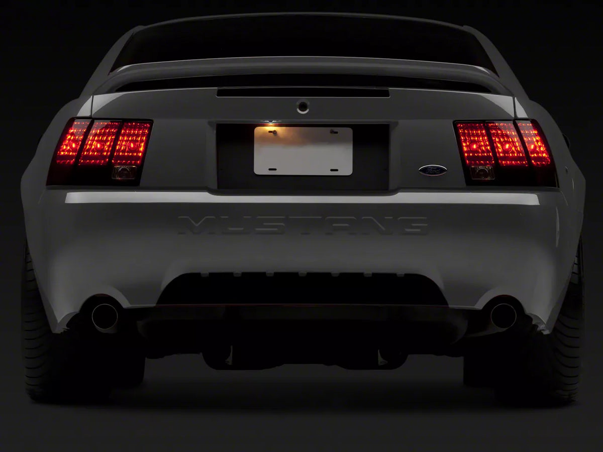 Raxiom Tail Lights; Black Housing; Smoked Lens (99-04 Mustang, Excluding 99-01 Cobra)